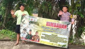 Bentangkan Spanduk Larangan PETI, Polsek Tebo Ilir Ingatkan Ancaman Penjara 5 Tahun