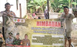 Cegah Aktivitas PETI, Polisi Sosialisasikan Ancaman Pidana Lewat Spanduk di Tebo Ilir